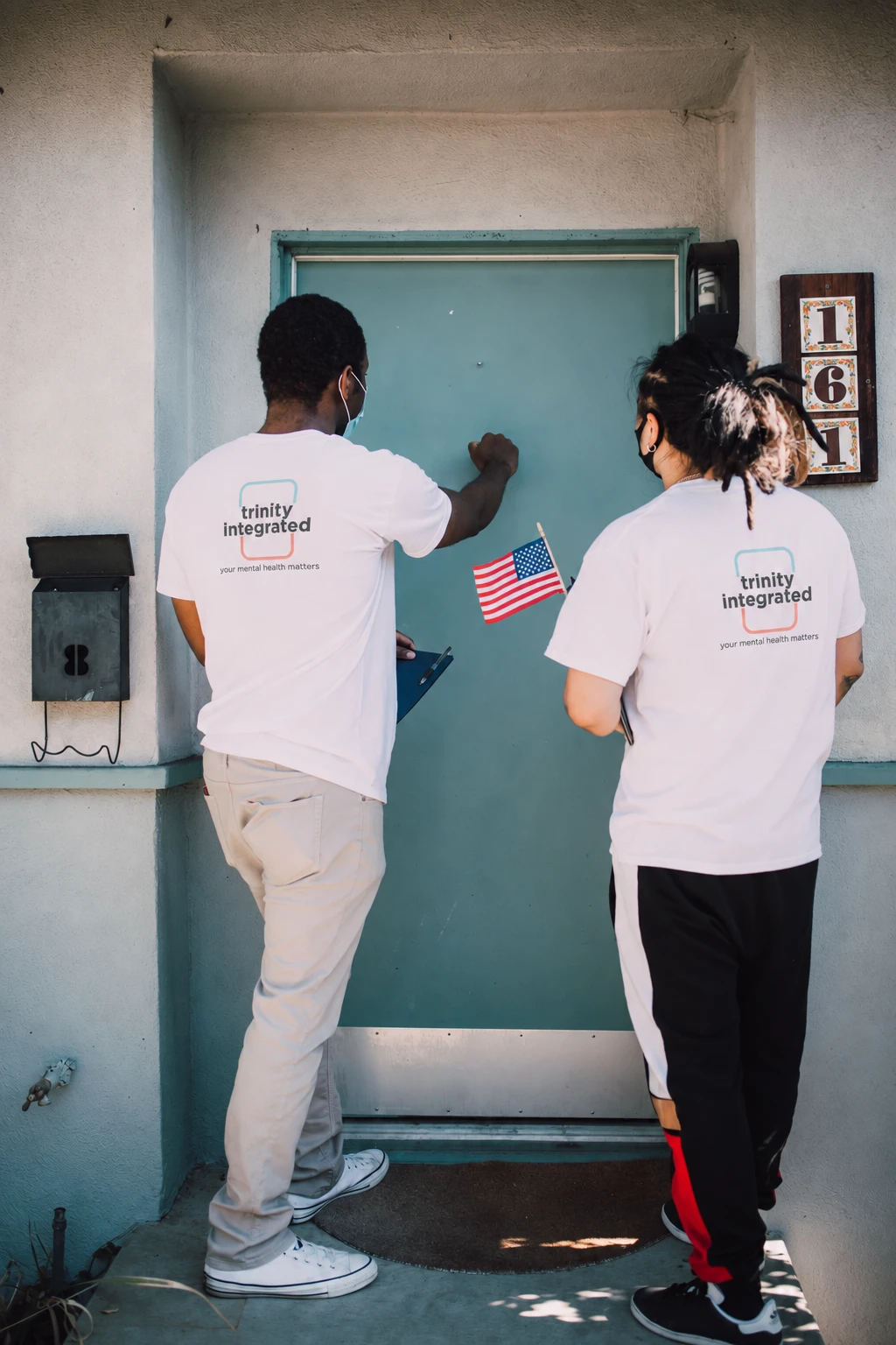 Community support workers making a home visit